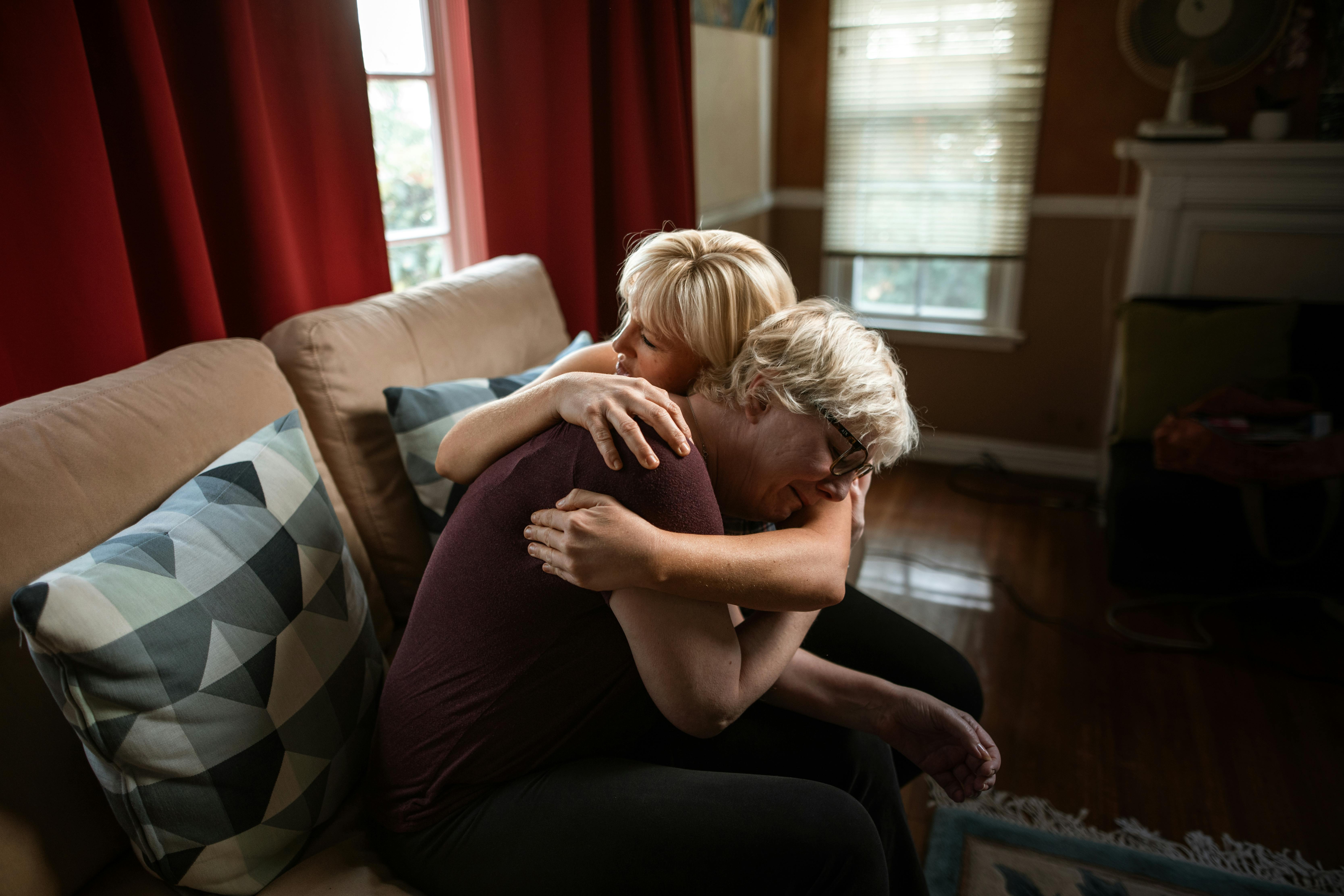 How to Get Over a Narcissist: Two people hugging on a couch